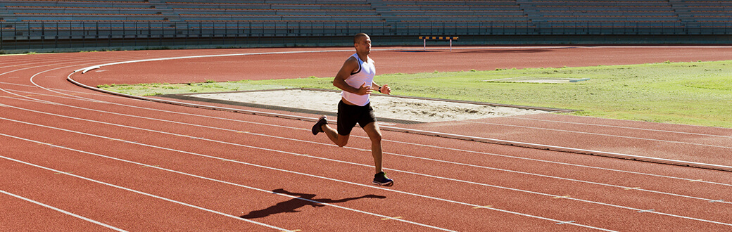 A man running on a track.