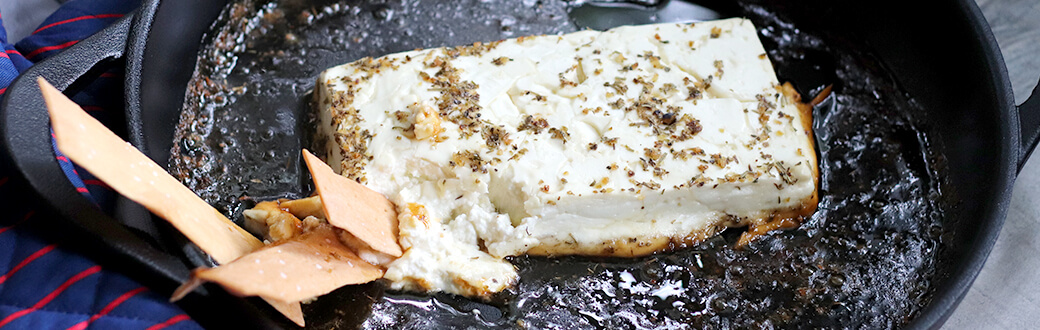 Agave and Herbs de Provence Baked Feta in a pan.