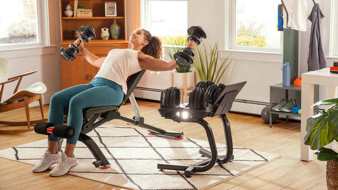 Woman weight lifting using 5.1s Bench