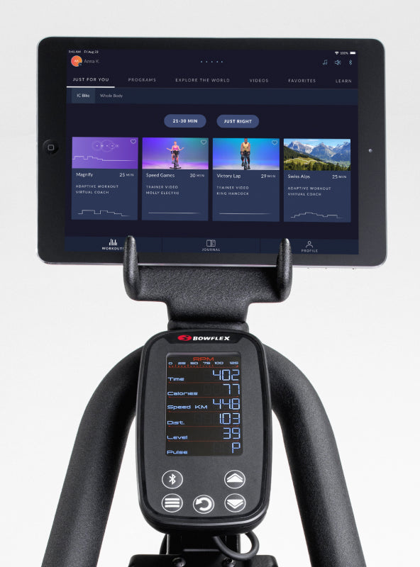 BowFlex C6 Bike media rack holding a tablet displaying JRNY app screen.