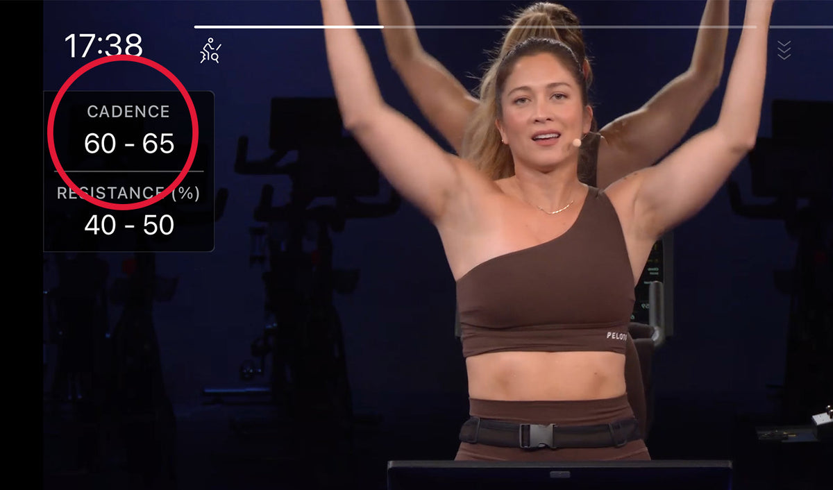 A screenshot of the Peloton app showing a paused indoor cycling workout with a highlighted 'Cadence' information card on the left of the screen.