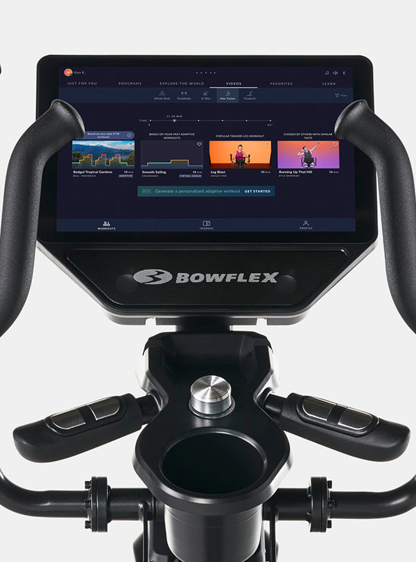 Close-up of a BowFlex Max Total 16 console and handlebar area.