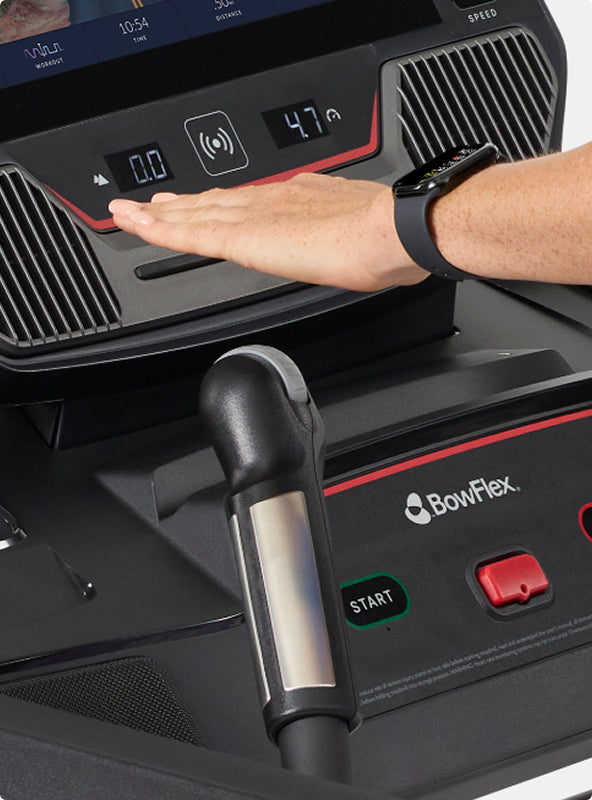 Hand hovering over the Quick Dial control on the BowFlex T16 Treadmill.