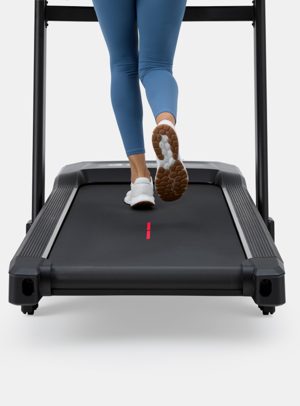 Person running on the BowFlex T9 Treadmill running path.