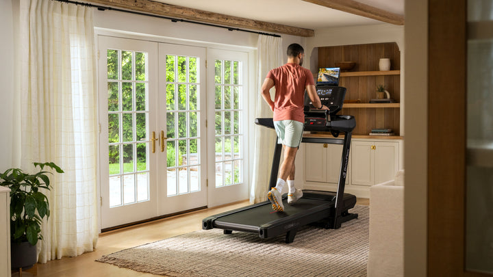 Man running on the T9 Treadmill in home