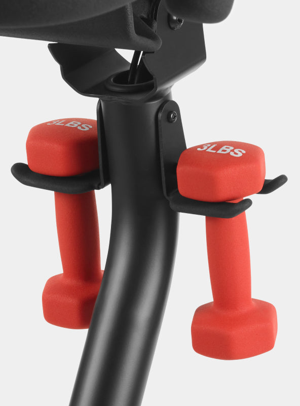 A pair of 3 pound dumbbells in cradles on BowFlex VeloCore Bike 22.