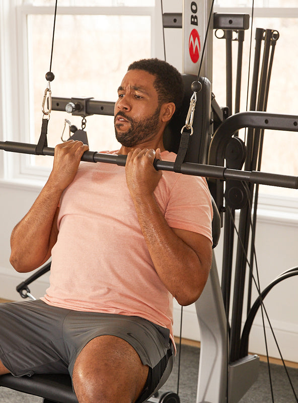 Man using the BowFlex Xtreme 2 SE straight bar.