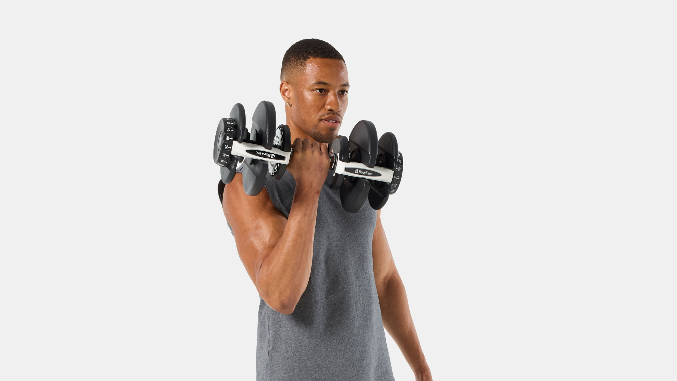 BowFlex Results Series 90 SelectTech Dumbbells - Man doing a curl with dumbbell - default view