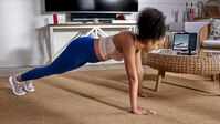 Woman working out with JRNY tablet holder--thumbnail