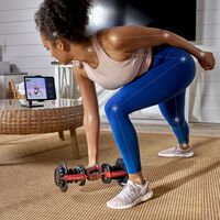 Woman working out with JRNY tablet holder--thumbnail