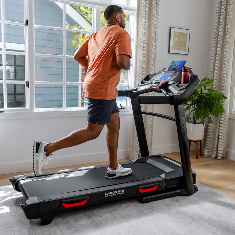 Woman jogging on a Bowflex BXT8J Treadmill - mobile expanded view