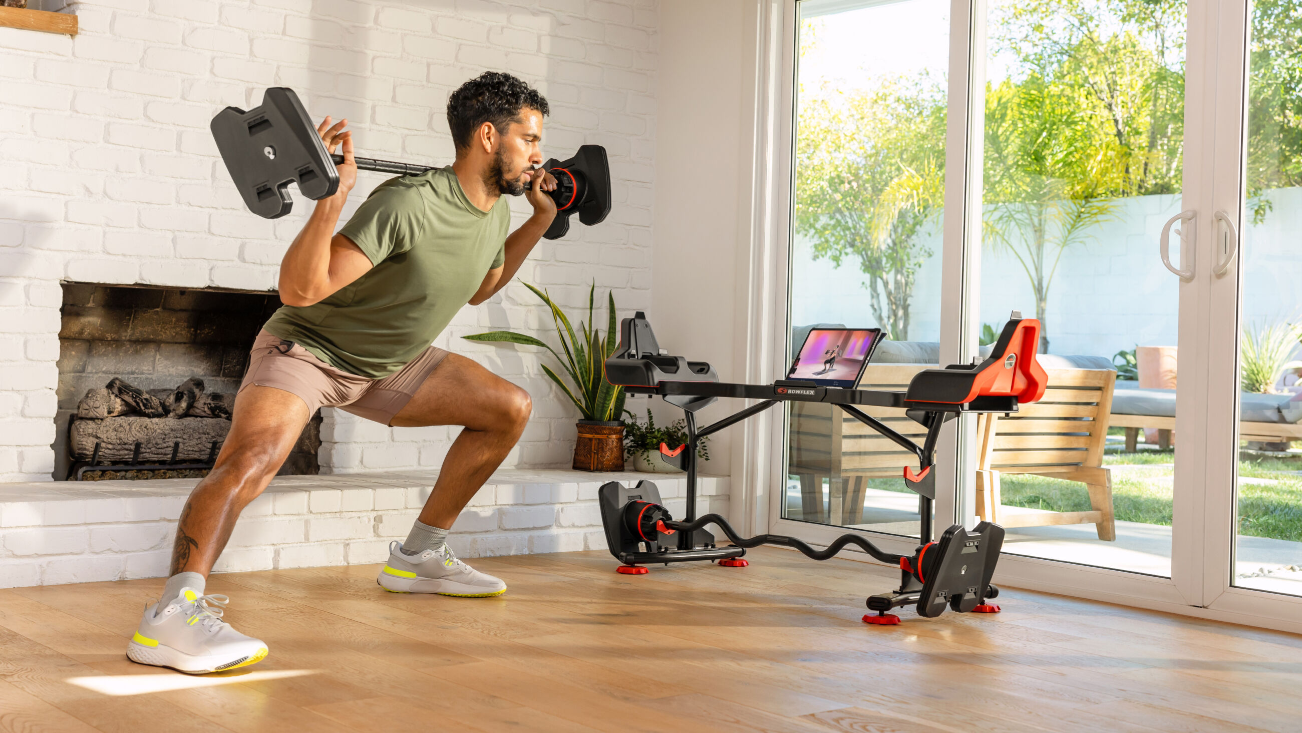 https://www.bowflex.com/dw/image/v2/AAYW_PRD/on/demandware.static/-/Sites-nautilus-master-catalog/default/dw9e24317e/images/bfx/weights/100874/2080-barbell-side-lunge-in-home-m-lr.jpg?sw=2600&sh=1464&sm=fit