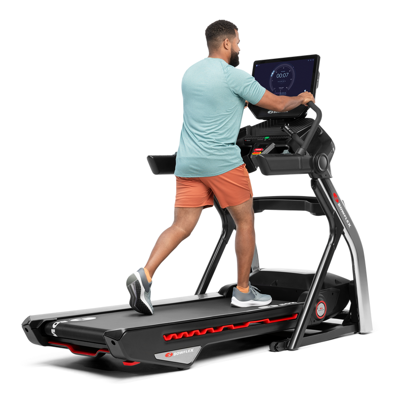 Man using the extended handlebars on the Treadmill 22 - expanded view