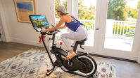 Woman riding BowFlex VeloCore Bike--thumbnail