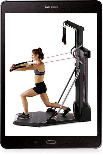 A tablet displaying a fit woman using the Bowflex HVT.