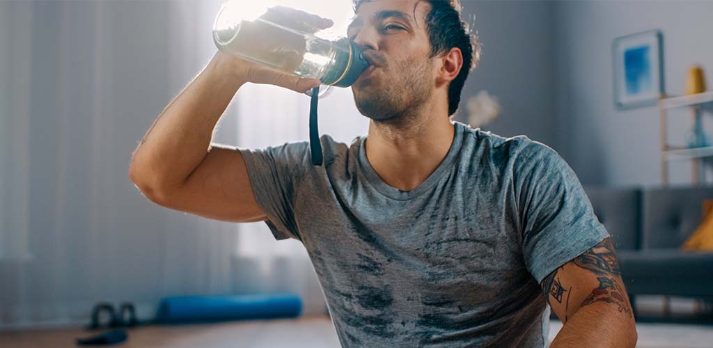 A man drinking water.