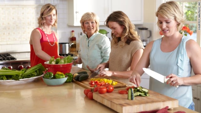 Colleen Whiteaker cooking with her three daughters