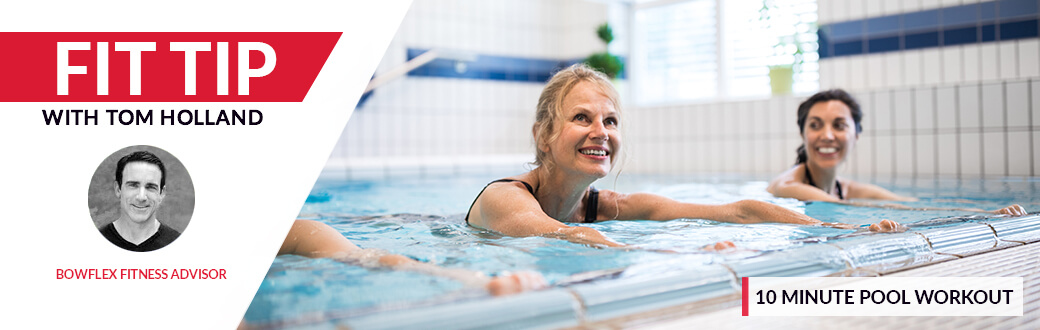 Three women working out in an indoor pool.