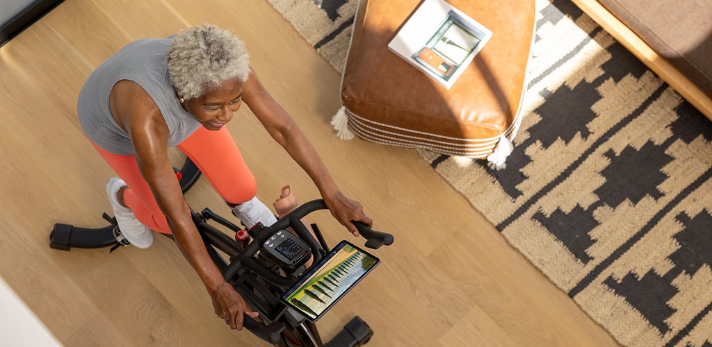 Woman riding an exercise bike