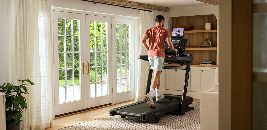 man running on a bowflex treadmill