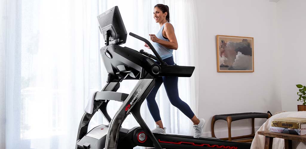 A woman running on a BowFlex Treadmill.