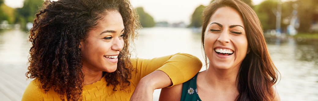 Two women laughing.