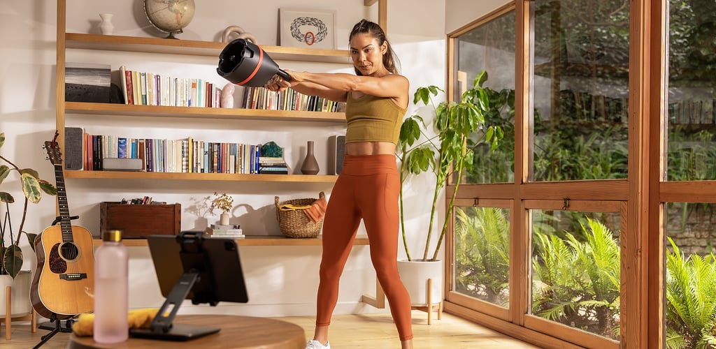 woman using selettech 840 kettlebell
