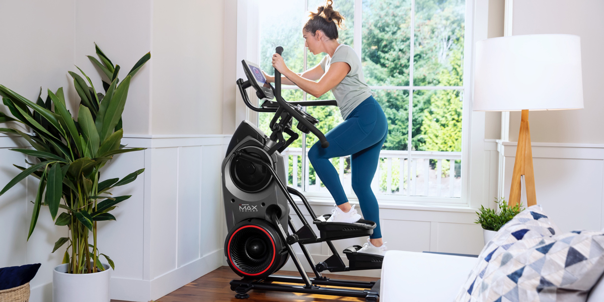A woman using a Bowflex Max Trainer M9.