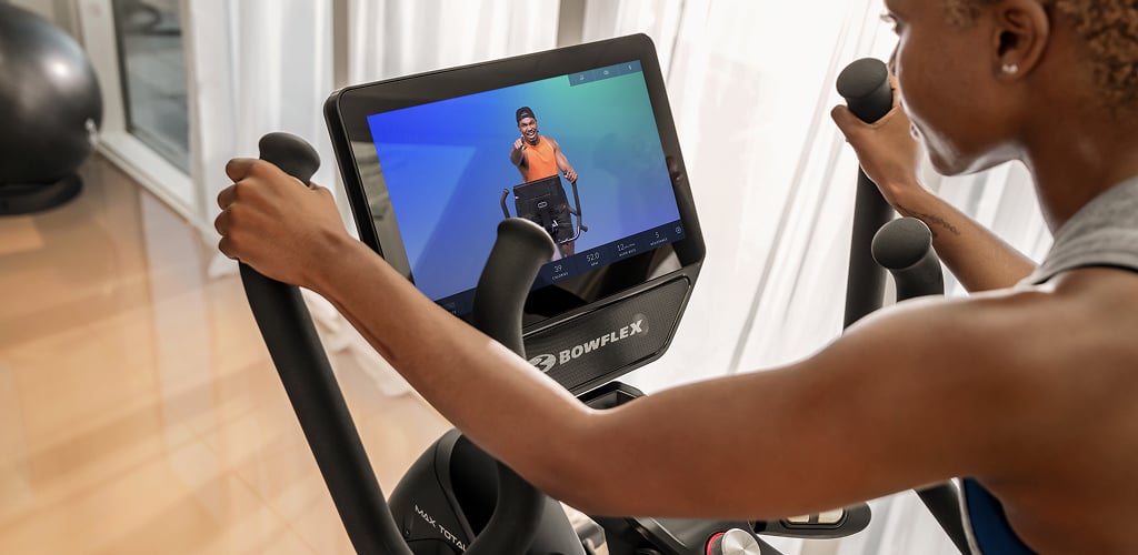 Woman looking at the screen of a Max Total 16