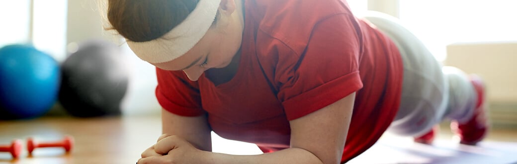 A woman performing a plank.