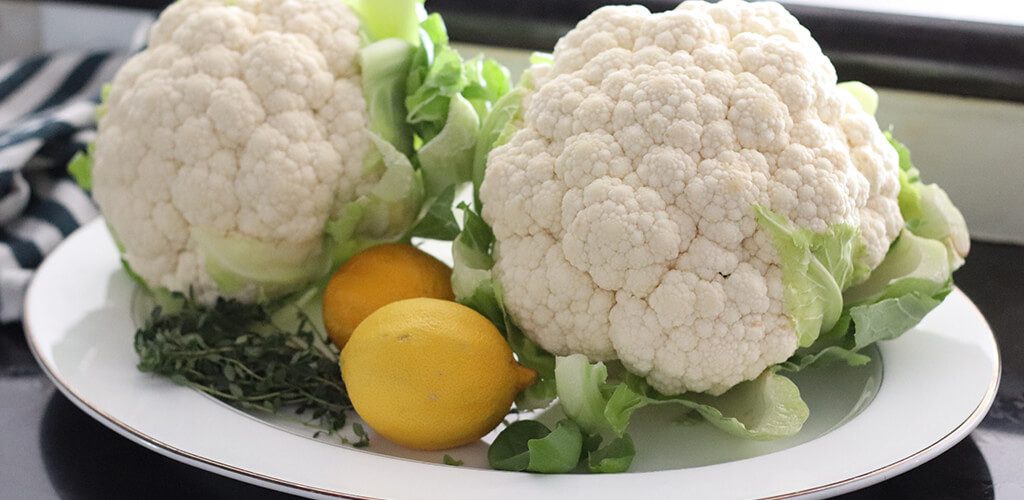Heads of cauliflower with a lemon and herbs
