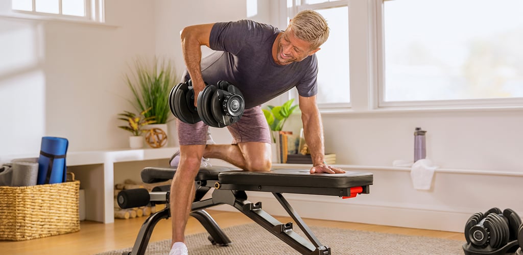 man using selettech 552 dumbbell