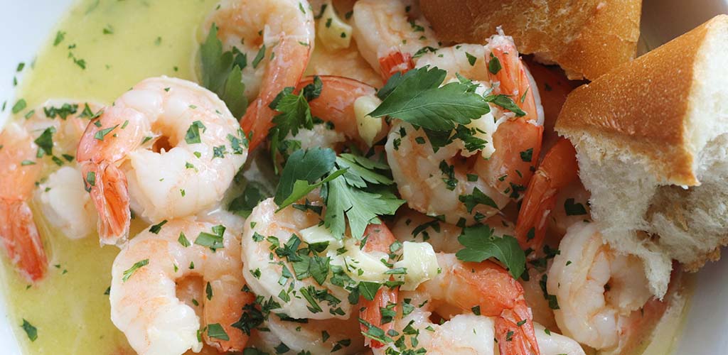 Shrimp scampi in a serving dish.