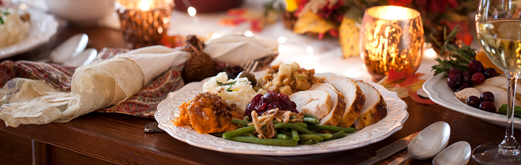 A dinner plate filled with Thanksgiving Day foods.