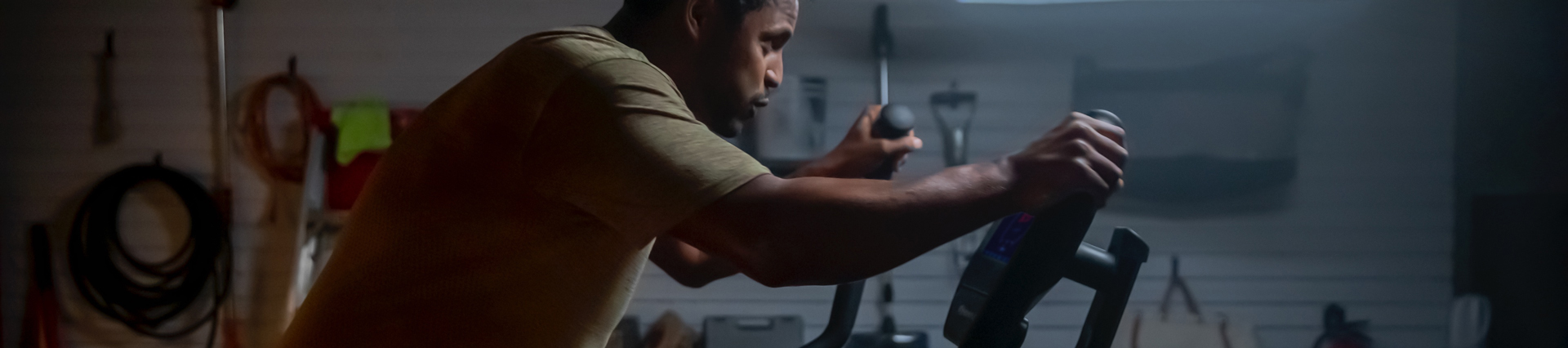 athletic man using a Bowflex Max Trainer