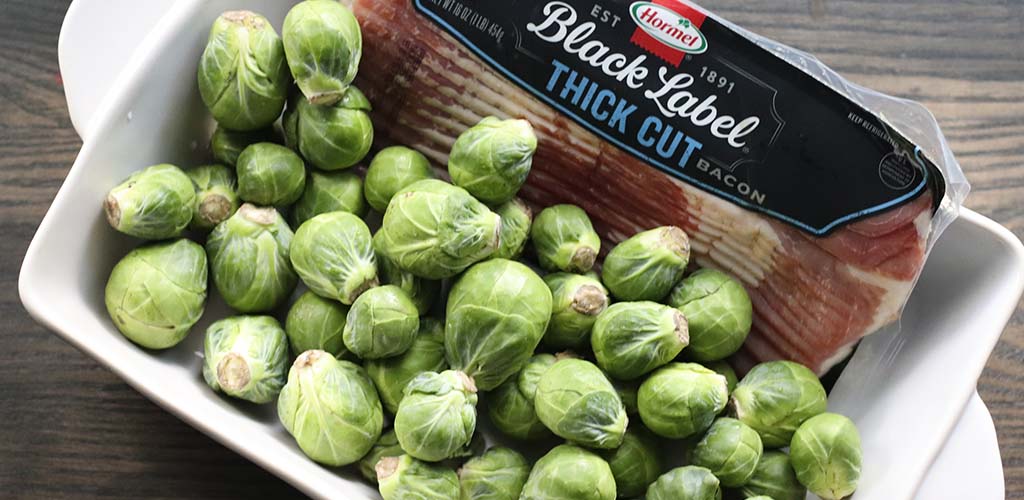 brussels sprouts and bacon, ingredients in a baking dish