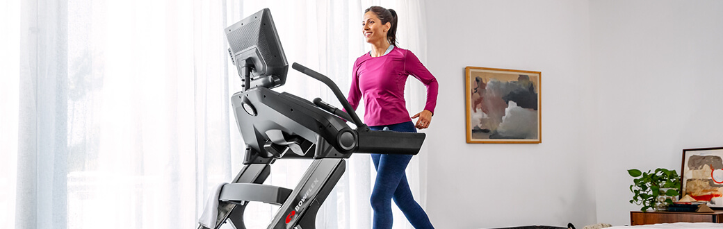 Woman using a Bowflex Treadmill.