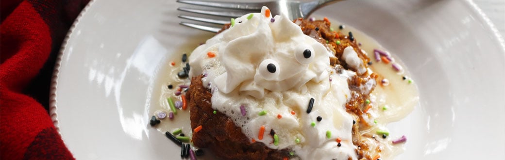 A slice of pumpkin carrot cake on a plate.