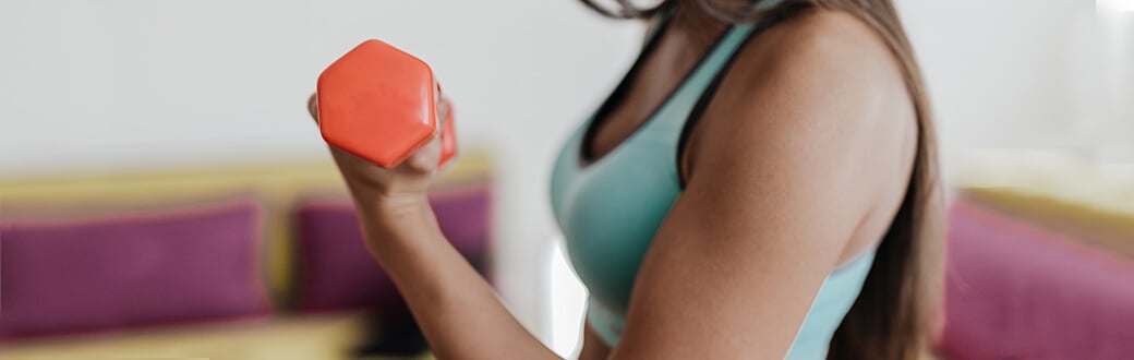 A woman performing a biceps curl.