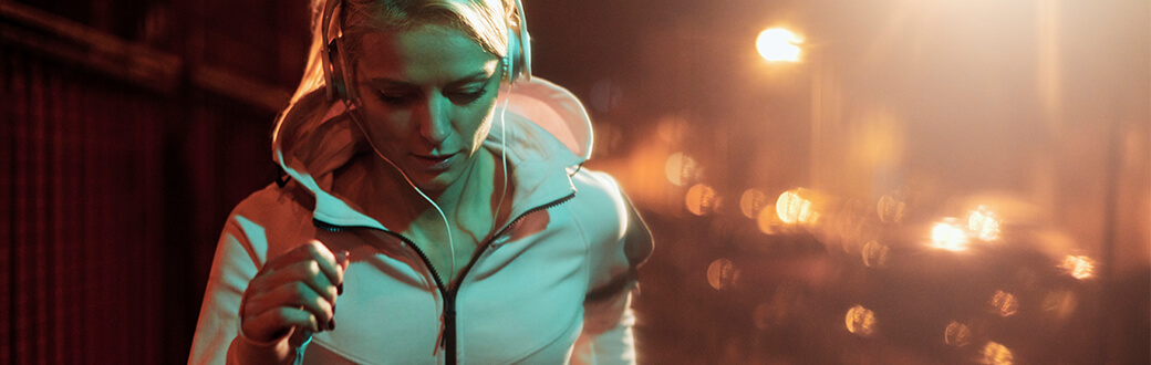 A woman running at night.