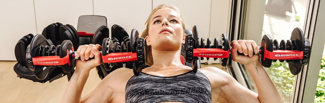 A woman performing a chest press