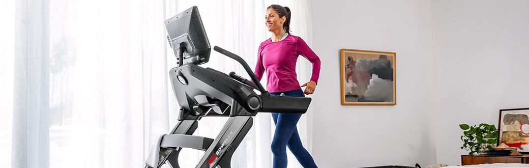 Woman using a BowFlex Treadmill.