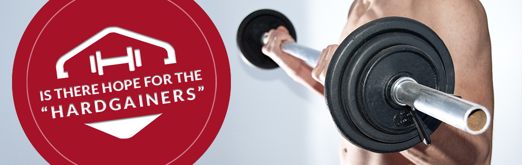 A fit man performing a biceps curl with a barbell. Hope for the Hardgainers.
