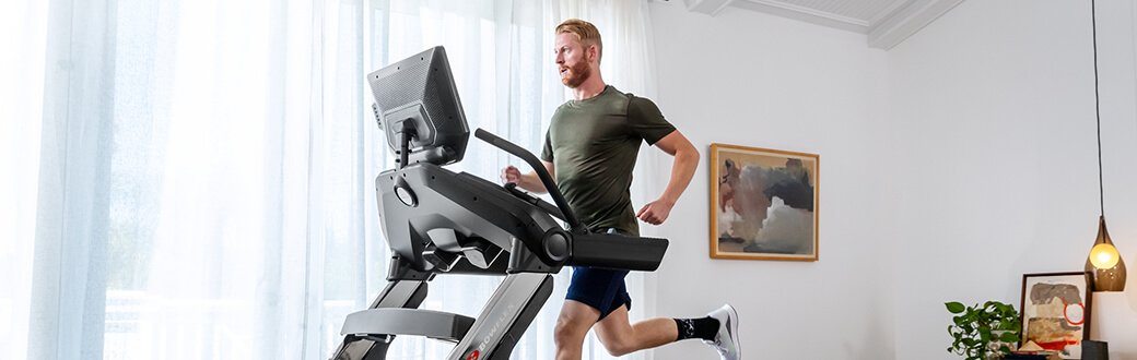 A man running on a Bowflex Treadmill 22.