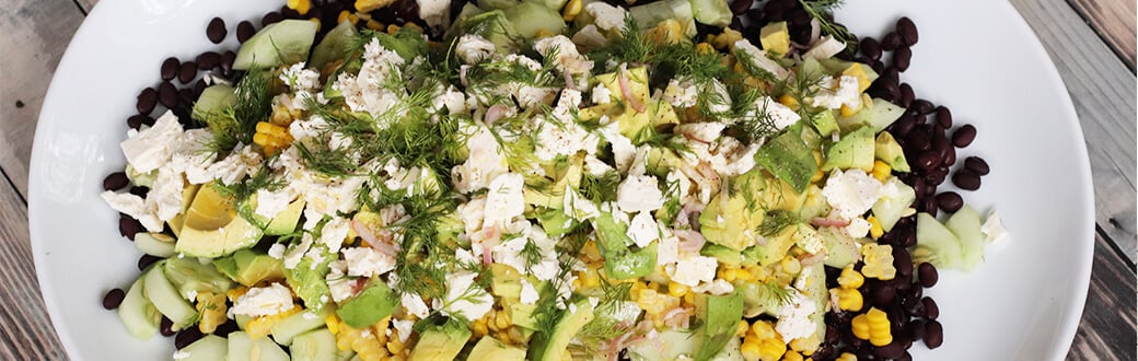 Cucumber and black bean salad on a serving plate.