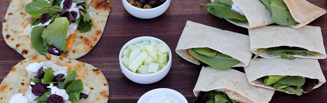 Grilled chicken pitas on a cutting board