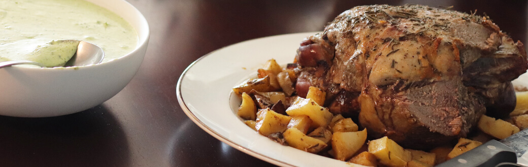 Roasted lamb served with potatoes and sauce