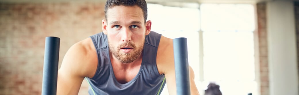 A man performing a sled workout.