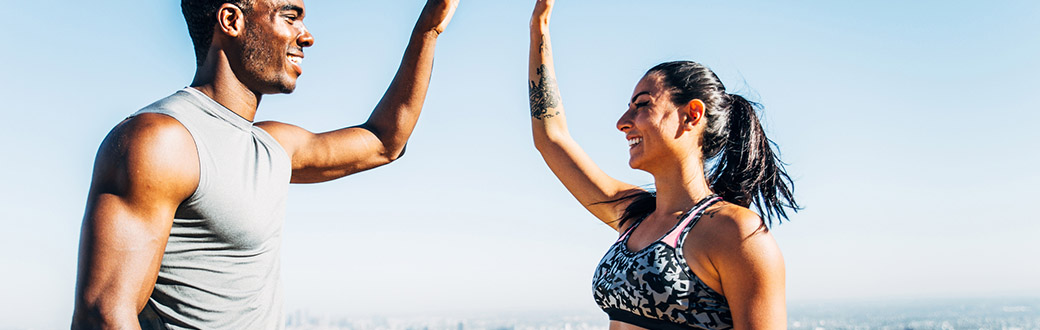 athletic couple high-five