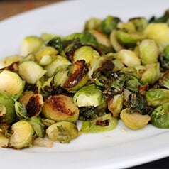 garlic roasted brussels sprouts served on a plate